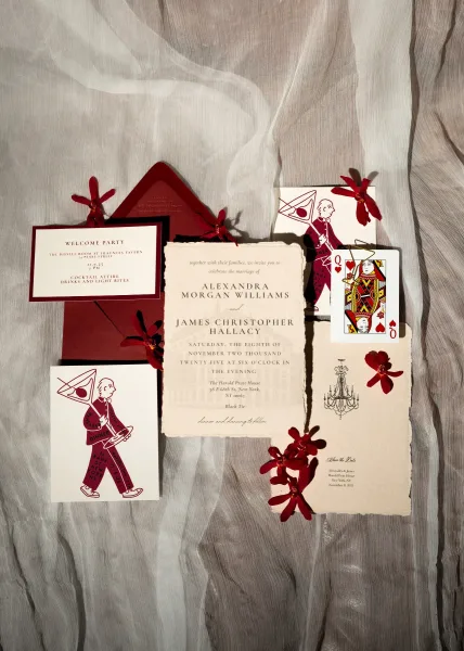 Wedding invitation suite with a coordinating save the date card, styled with a bold red envelope and neatly arranged for a refined stationery look.
