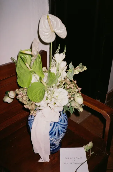 Wedding floral arrangement with white flowers and greenery, featuring anthurium for sculptural contrast.