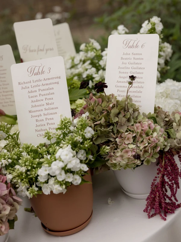 A Burgundy and Green Wedding Draped Between Old Plaster and Weathered Wood
